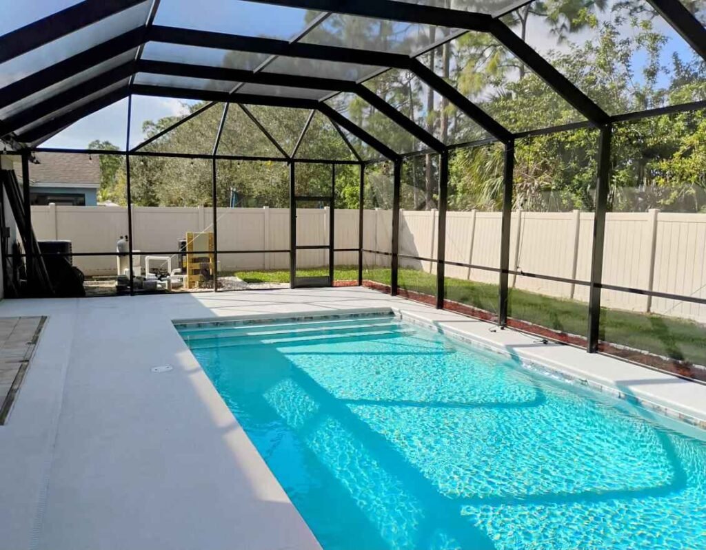 pool screen enclosure installation in Tallahassee, FL over residential backyard swimming pool